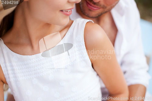Image of couple in shades at sea side