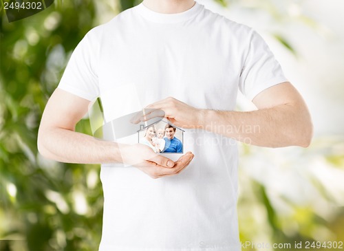 Image of family with child and dream house