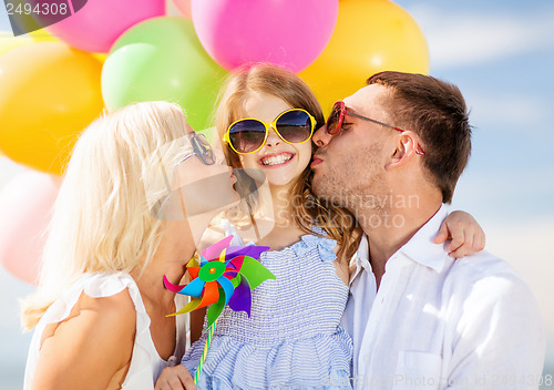 Image of family with colorful balloons