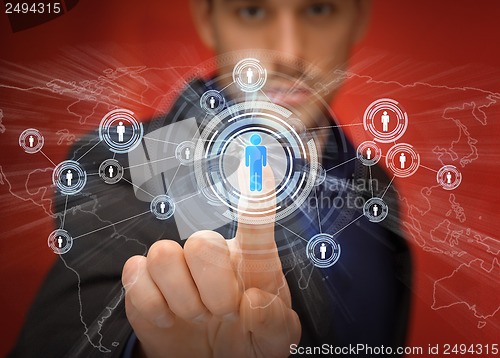 Image of businessman pressing button with contact