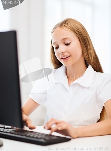 Image of student girl with computer at school