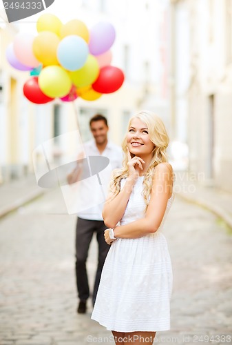 Image of couple with colorful balloons