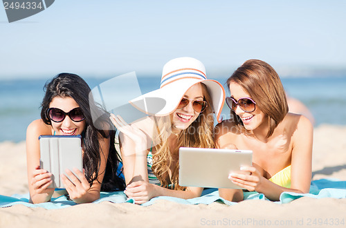 Image of girls with tablet pc on the beach