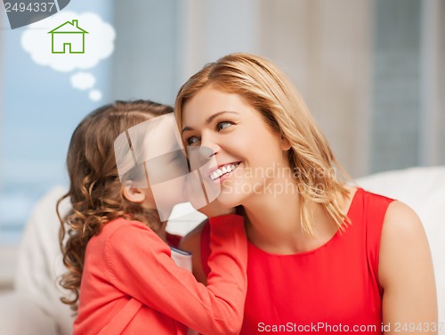Image of mother and daughter with eco house
