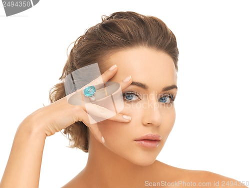 Image of woman with blue cocktail ring
