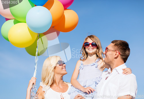 Image of family with colorful balloons