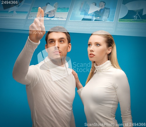 Image of man and woman working with virtual screen