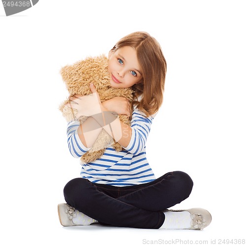 Image of cute little girl hugging teddy bear