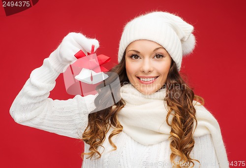 Image of smiling woman in mittens and hat with jingle bells