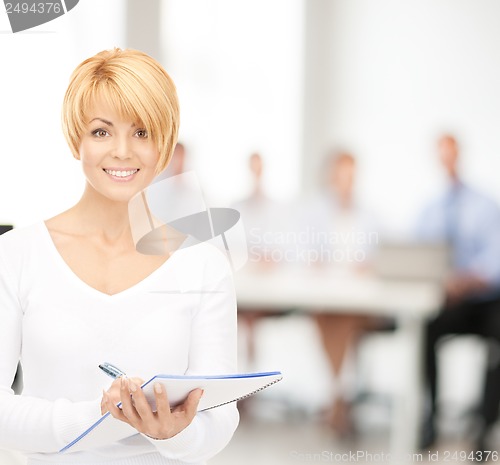 Image of happy woman with big notepad