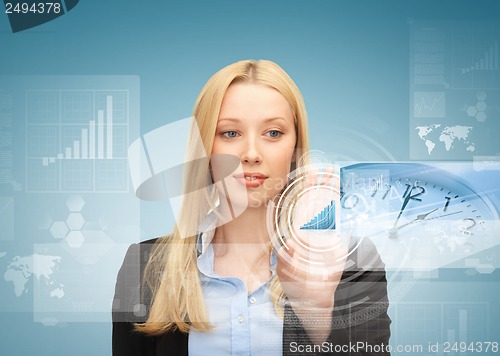 Image of businesswoman pointing at graph