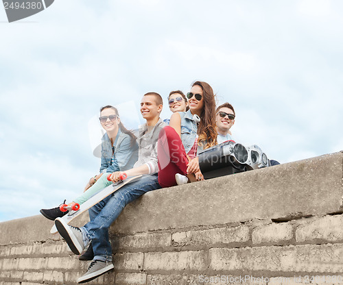 Image of group of teenagers hanging outside