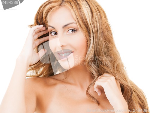 Image of face and hands of happy woman with long hair