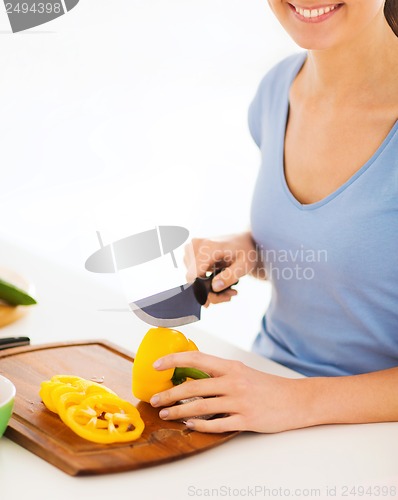 Image of woman cutting vegetables