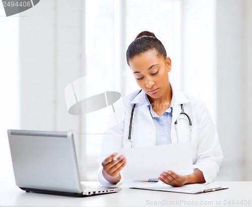 Image of female doctor with laptop pc