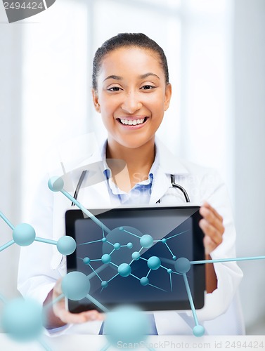 Image of african female doctor with tablet pc and molecules