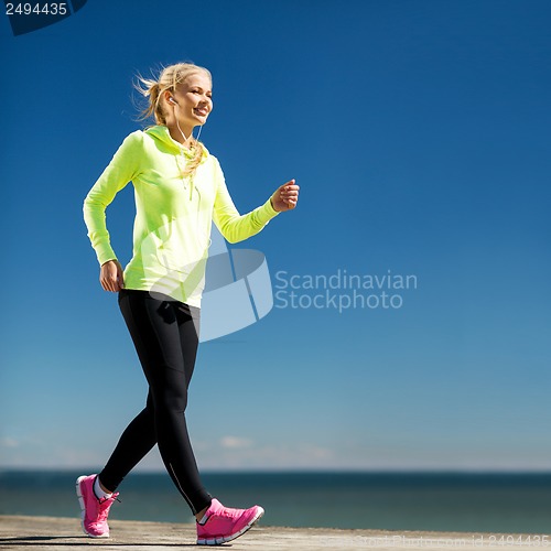 Image of woman doing sports outdoors