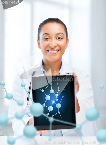 Image of african female doctor with tablet pc and molecules