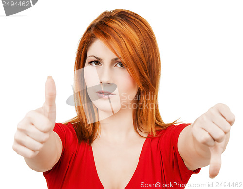 Image of businesswoman with thumbs up and down