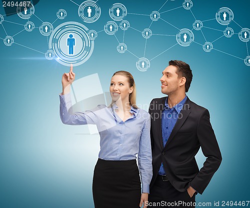 Image of man and woman working with virtual screen