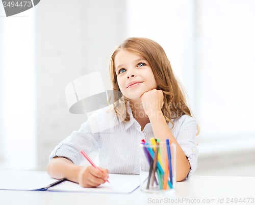 Image of little student girl drawing at school