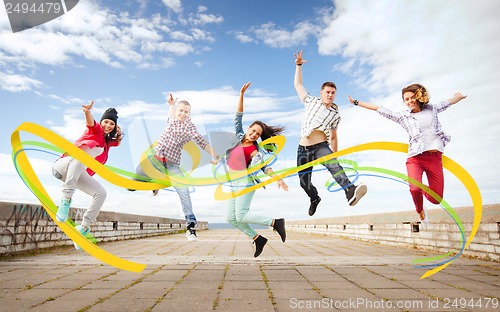 Image of group of teenagers jumping