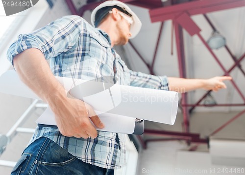 Image of man with blueprint