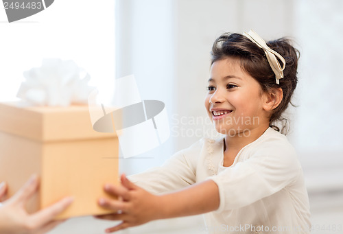 Image of happy child girl with gift box