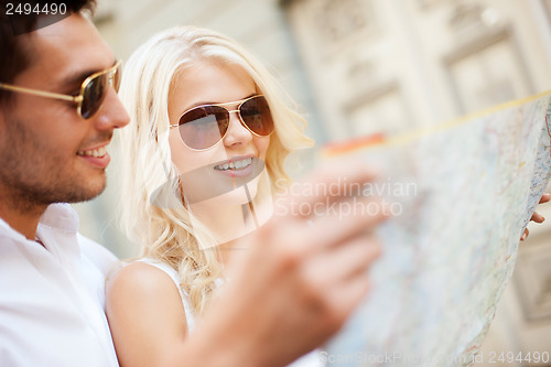 Image of couple with map in the city