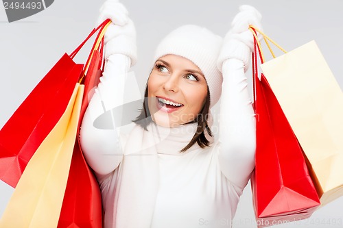 Image of picture of happy woman with shopping bags