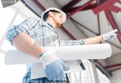 Image of man with blueprint