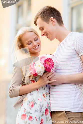 Image of couple with flowers in the city
