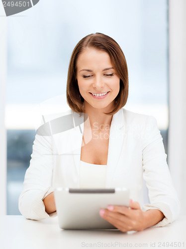 Image of businesswoman with tablet pc in office