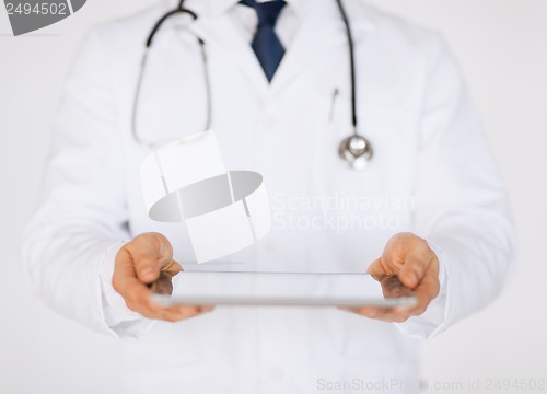 Image of male doctor holding tablet pc and stethoscope