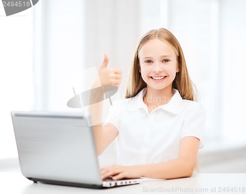 Image of girl with laptop pc at school