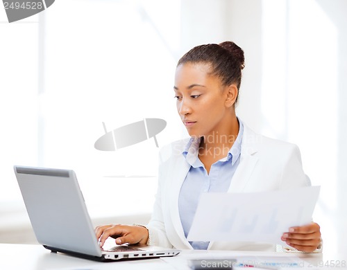 Image of businesswoman working with computer in office