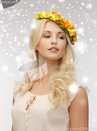 Image of woman wearing wreath of flowers