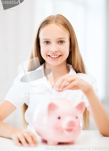 Image of child with piggy bank