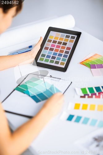 Image of woman working with color samples for selection