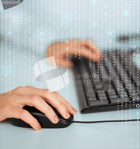 Image of woman hands with keyboard and mouse