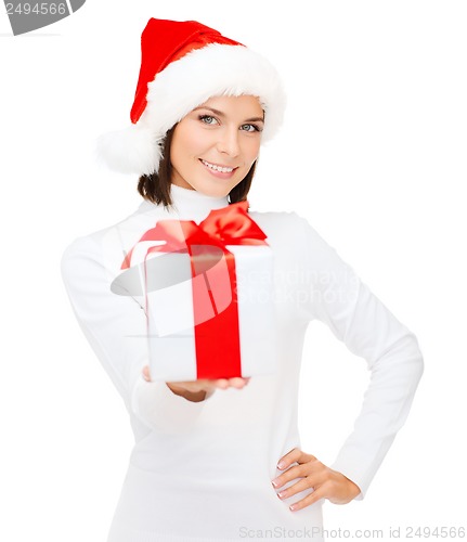 Image of smiling woman in santa helper hat with gift box