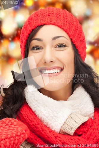 Image of beautiful woman in hat, muffler and mittens