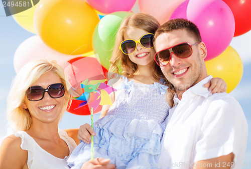 Image of family with colorful balloons