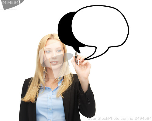 Image of businesswoman drawing blank text bubble