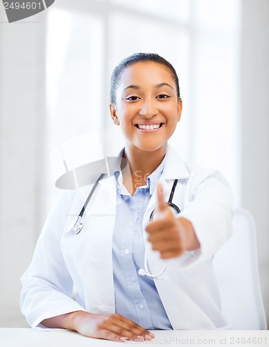 Image of doctor with stethoscope showing thumbs up