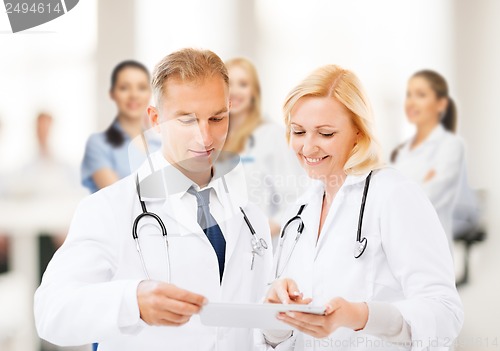 Image of two doctors looking at tablet pc