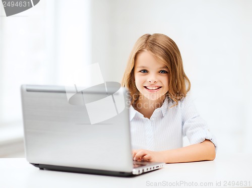 Image of girl with laptop pc at school