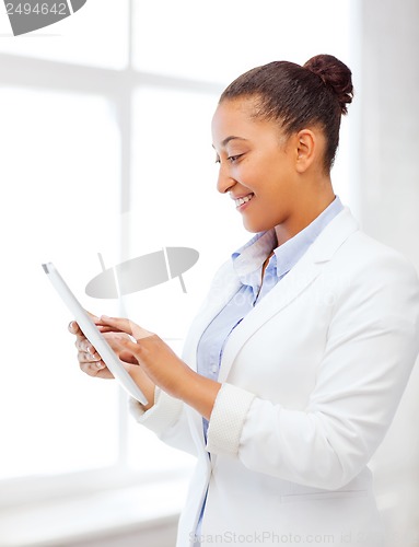 Image of businesswoman with tablet pc in office