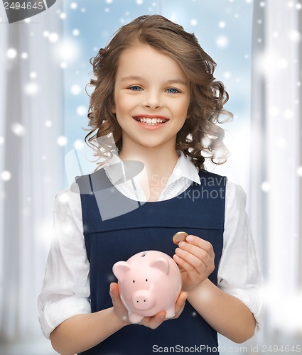 Image of girl with piggy bank