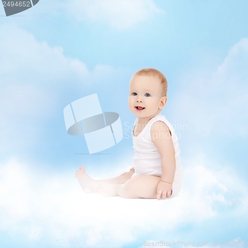 Image of smiling baby sitting on the cloud